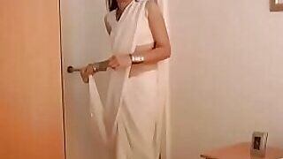 jasmine mathur indian turn beside hew in white sari